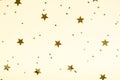 Golden stars composition on beige background, party and celebration decoration