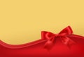 Golden stary background with red bow decoration