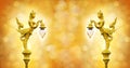 Golden statue of angel hold the lamp on the bokeh background Royalty Free Stock Photo