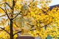 Golden statue in fall Royalty Free Stock Photo