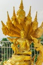 Golden statue of Buddha and dragons in the temple in Phuket. Thailand