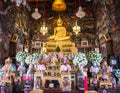 Golden statue of buddha inside the Ordination Hall at the Wat Arun temple, Bangkok