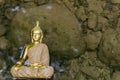 golden statue of a buddha in a river Royalty Free Stock Photo