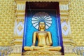 Golden statue of Buddha sitting with many gold buddha