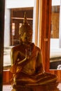 Golden statue of Buddha at the Thai Buddhist temple Royalty Free Stock Photo
