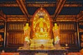 The golden statue of the Buddha and two monks of the Da Ci`en Temple, Xian, China Royalty Free Stock Photo