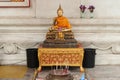 A golden statue of Buddha was installed under the hall of the main building of Wihan Phra Mongkhon Bophit in Ayutthaya (Thailand)