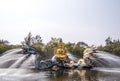 Golden statue Goddess of mercy. Beautiful Drip Fountain Porcelain Standing Quan Yin Statues with Dragons at Ancient Town Bangkok