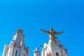 Golden Statue of Jesus Christ on the facade of the Temple of the Sacred Heart of Jesus, Barcelona, Catalonia, Spain