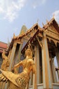 Golden statue of a Kinnara guarding Wat Phra Kaew