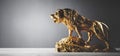 Golden statue of lion roaring, a sculpture. Concept of a strength, power