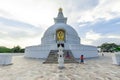 Golden statue of lord Gautam Buddha Buddhist site Vishwa Shanti (World Peace) stupa Royalty Free Stock Photo