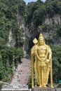 Golden statue of Lord Muragan at the entrance of Batu Caves Hindu Temple near Kuala Lumpur, Malaysia Royalty Free Stock Photo