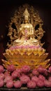 golden statue of Place Guanyin on a lotus throne generative AI