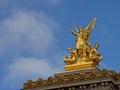 Golden statue of poetry on top of the opera of Paris, France, side view Royalty Free Stock Photo