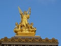 Golden statue of poetry on top of the opera of Paris, France Royalty Free Stock Photo