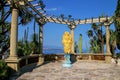 Golden statue at the terrace in Botanical Garden, Les Revories q