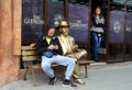 Golden Statue and Two People