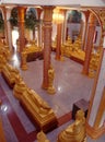 Golden statues of Buddha in different positions in the main hall of Wat Chalong temple Royalty Free Stock Photo