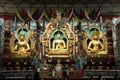 Golden statues of Gautama Buddha, Padmasambhava and Amitayus. Royalty Free Stock Photo