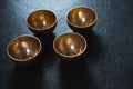 Golden steel bowls on table