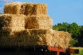 Golden straw bales stacked on wagon