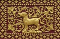 Golden stucco wall art in a Thai temple Royalty Free Stock Photo