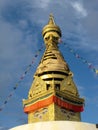 Golden stupa with Buddha eyes and pennants in the Swayambhunath Temple, the monkey temple. Kathmandu, Nepal Royalty Free Stock Photo