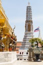 Golden stupa inside of Emerald Buddha temple on a sunny day in Bangkok, Thailand Royalty Free Stock Photo