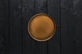 Golden stylish serving plate on black wooden table