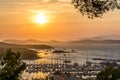 Golden summer sunset over the island of Porquerolles in south of France with reflection to the Mediterranean sea Royalty Free Stock Photo