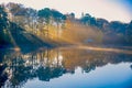 Golden sun rays across the lake