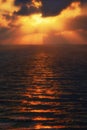 Golden sun rays on the sea at sunset Royalty Free Stock Photo