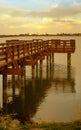 Golden Sun Sets on Lake and Pier