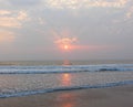 Golden Sun, Sunrays through Clouds and Reflection in Sea water - Payyambalam Beach, Kannur, Kerala, India