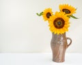 Golden sunflowers in a jug
