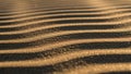 Shadows over rippled sand, creating a pattern of alternating light Royalty Free Stock Photo