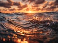 Golden sunlight reflecting on dynamic ocean waves during a vibrant sunset with dramatic clouds illuminating the horizon in warm Royalty Free Stock Photo