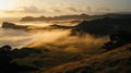 Golden sunrise mist over coastal hills Royalty Free Stock Photo