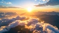 Golden sunrise over mountain peaks, clouds, and valleys, with bright sun rays. Royalty Free Stock Photo