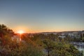 Golden sunrise in Prague taken from the Letna park, with cityscape and the Vltava river on the horizon Royalty Free Stock Photo