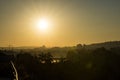 Golden sunrise in Prague taken from the Letna park, with cityscape and the Vltava river on the horizon Royalty Free Stock Photo