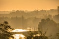 Golden sunrise in Prague taken from the Letna park, with cityscape and the Vltava river on the horizon Royalty Free Stock Photo