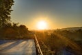 Golden sunrise in Prague taken from the Letna park, with cityscape and the Vltava river on the horizon Royalty Free Stock Photo