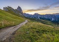Golden sunrise at Seceda, Dolomites, Italy, A stunning spectacle bathes the rugged landscape and meadows