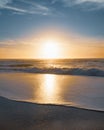 Golden sunset on the beach. Beautiful seascape in soft blue and yellow colors, relaxation, vacation concept Royalty Free Stock Photo