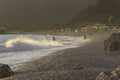 Golden sunset on the beach of the Mediterranean Sea. A yacht is moored at the shore Royalty Free Stock Photo