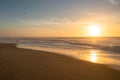 Golden sunset on the beach and silhouette of birds. Beautiful seascape in soft blue and yellow colors, relaxation Royalty Free Stock Photo