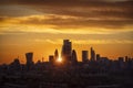 Golden sunset behind the silhouette of the skyscrapers of the City of London Royalty Free Stock Photo