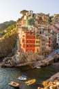 Golden sunset at the cliff at the Italian Riviera in the Village of Riomaggiore, Cinque Terre, Italy Royalty Free Stock Photo